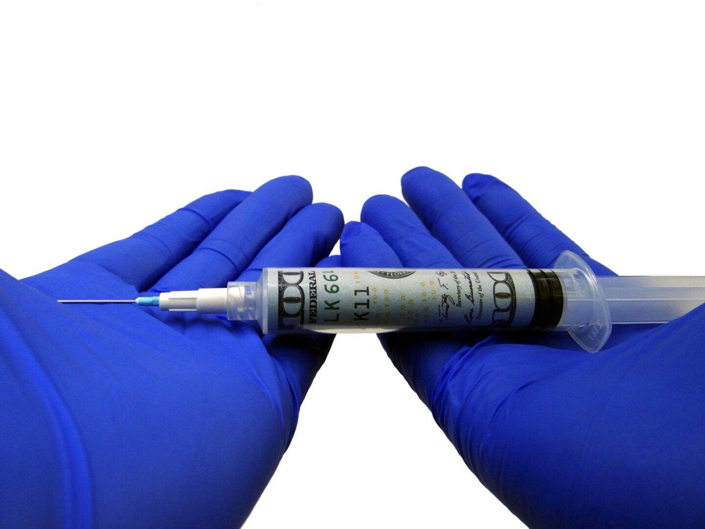 A person holding an injection in their hands.